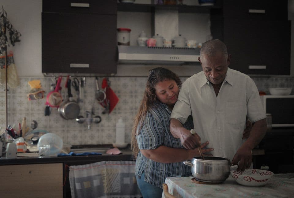 A man and woman preparing a meal together in the kitchen