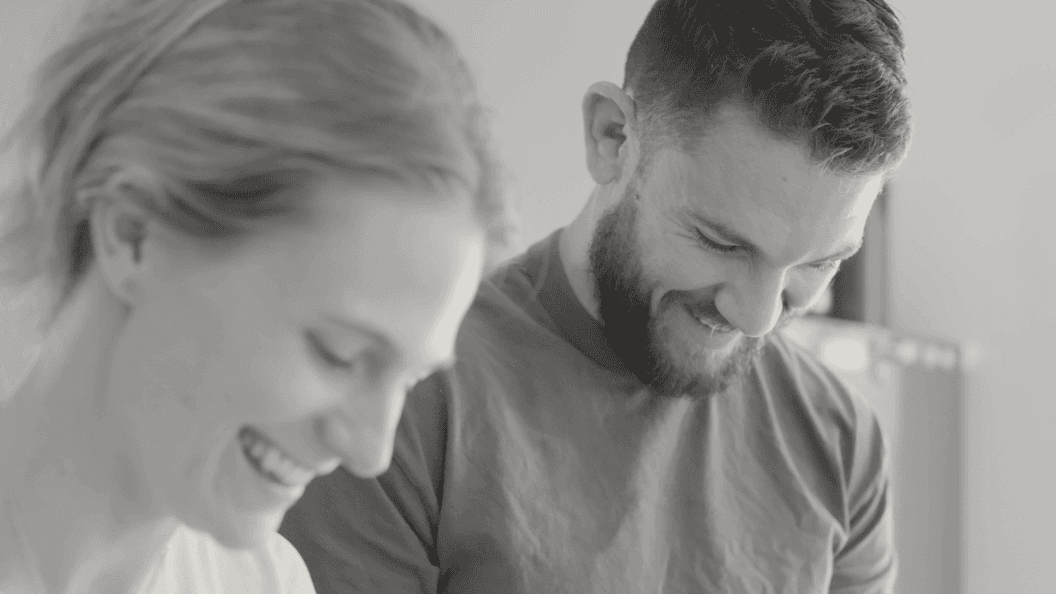 Woman and man enjoying working in the kitchen together