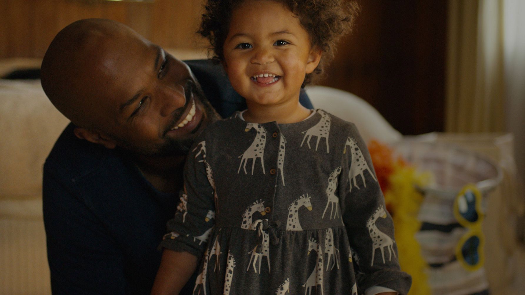 An image of a father and toddler with text overlay which reads "The Real Face of Men's Health".