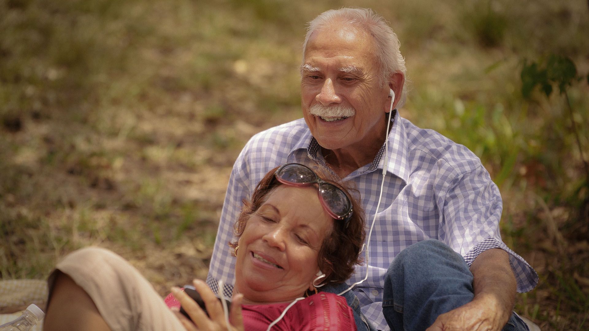 Photo of couple relaxing outdoors.
