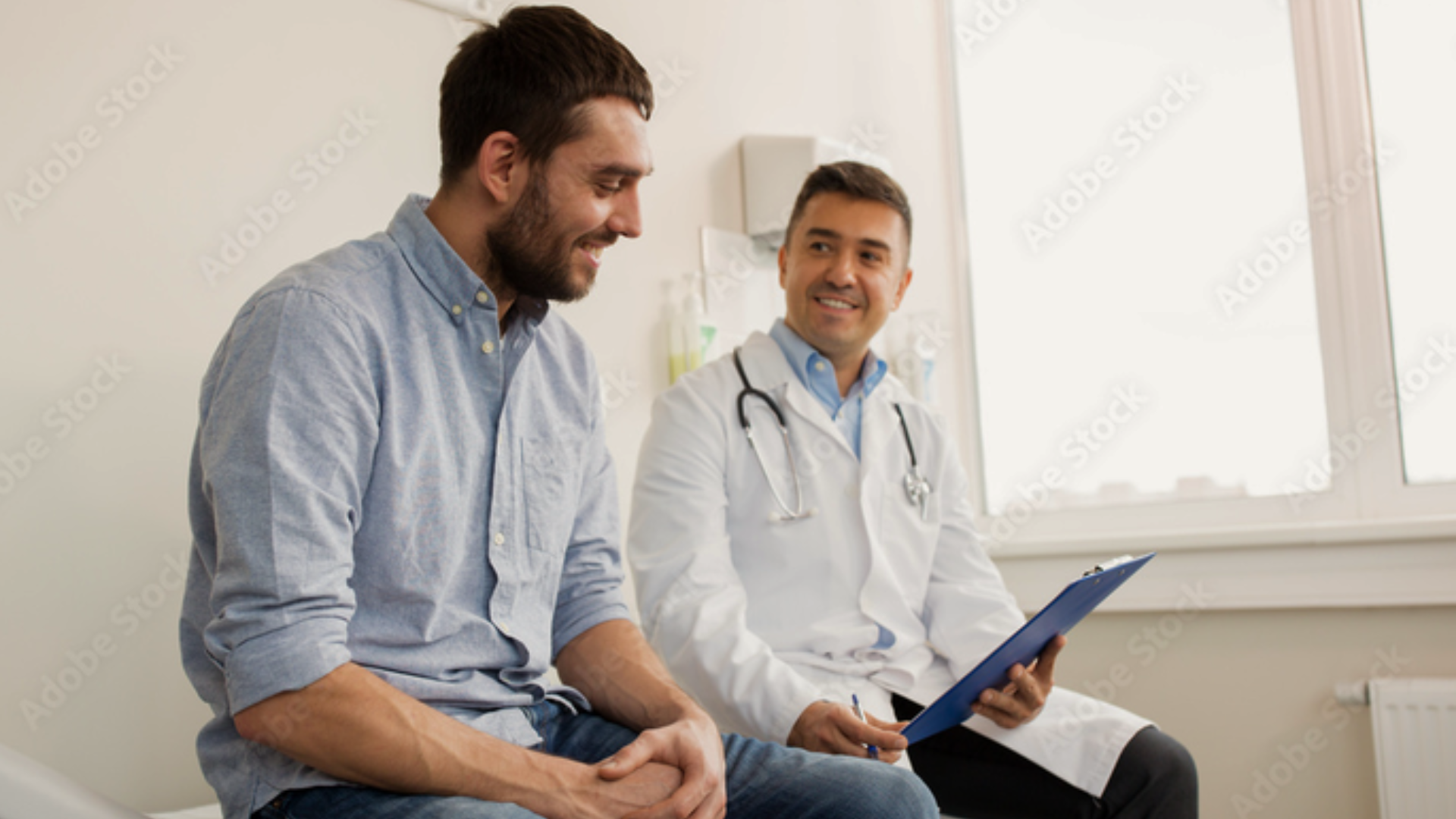 A doctor speaking with a male patient.