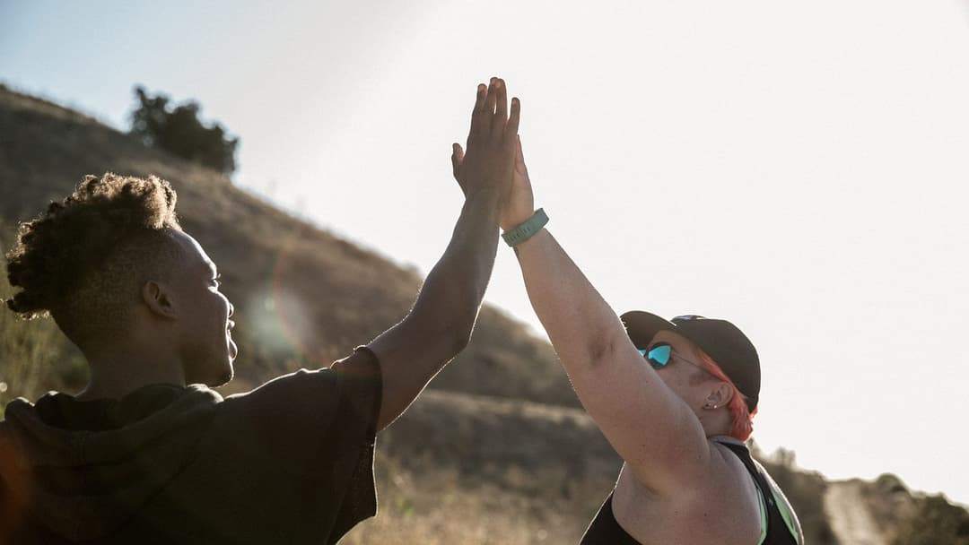 Two members of the Movember community high-fiving