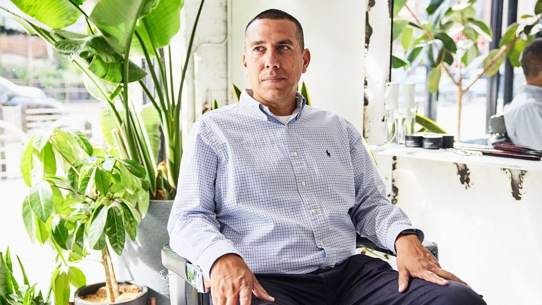 The Co-founder of a Movember-funded program sits in a Chicago-based barbershop chair.