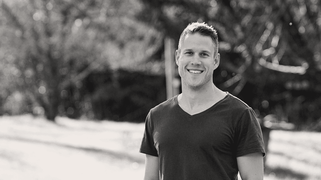 Man smiling in park