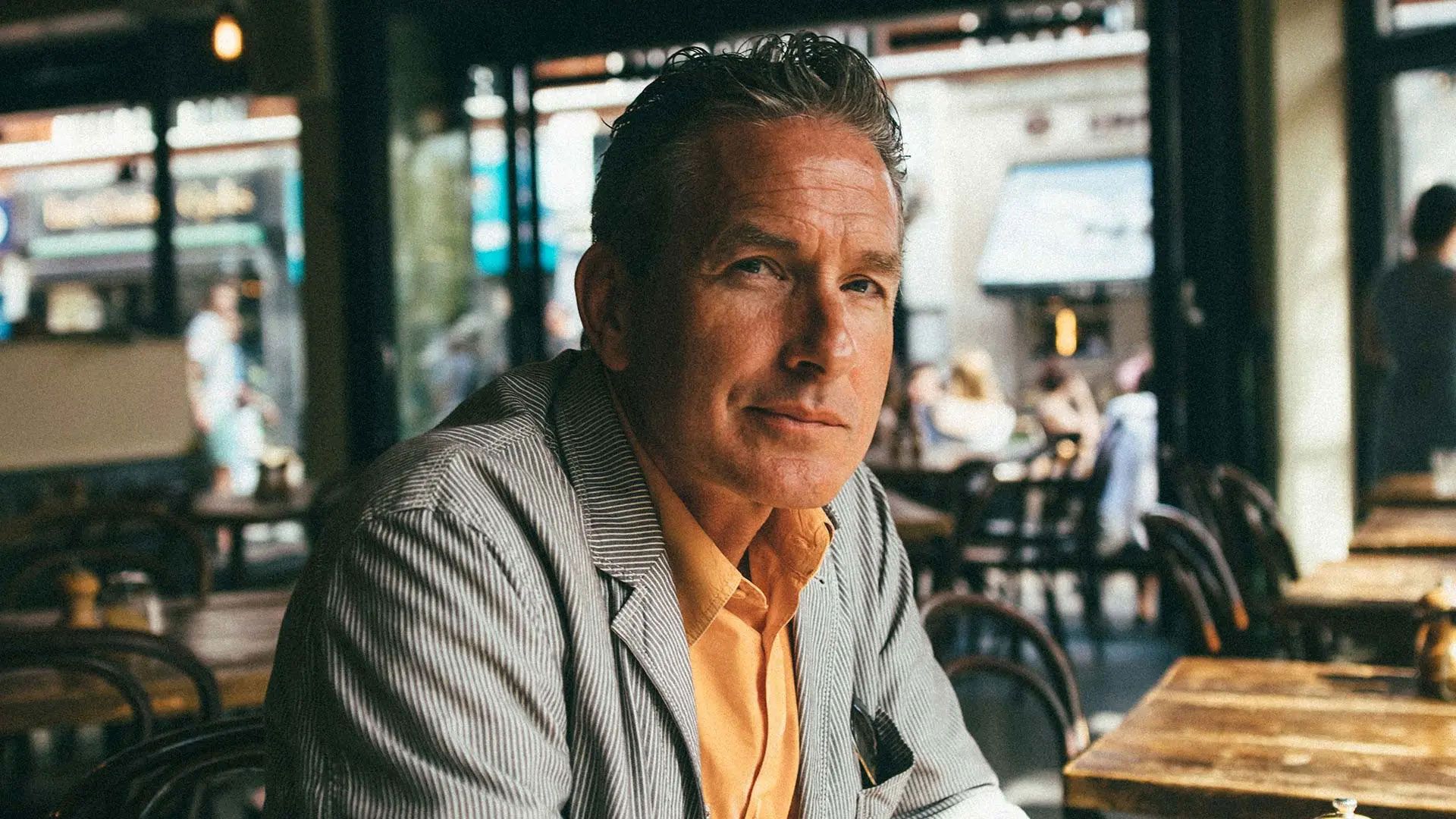 Photo of a middle-aged man looking thoughtfully to camera.